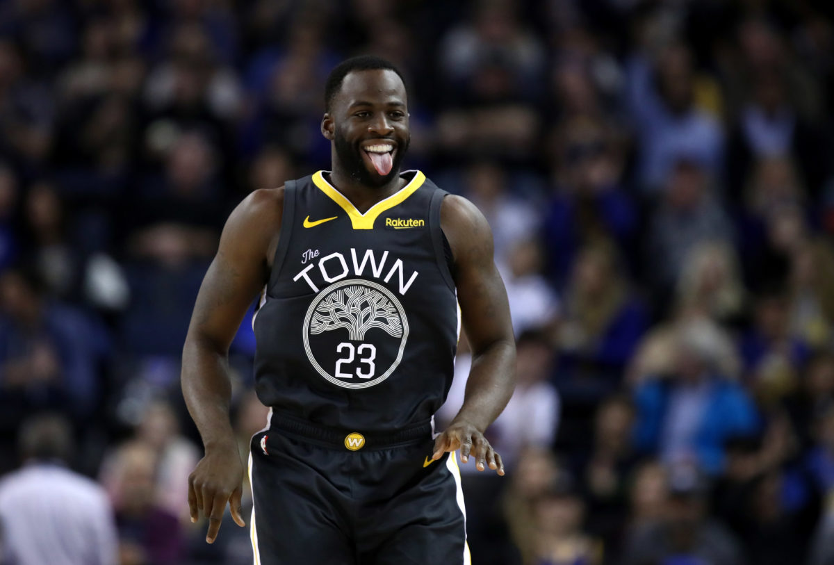 Draymond Green celebrating during a game.