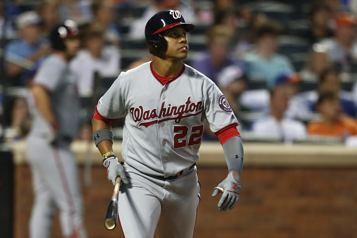 WASHINGTON, DC - SEPTEMBER 27: Washington Nationals right fielder Juan Soto  (22) picks up a handful of dirt to rub on his uniform prior to the New York  Mets versus the Washington