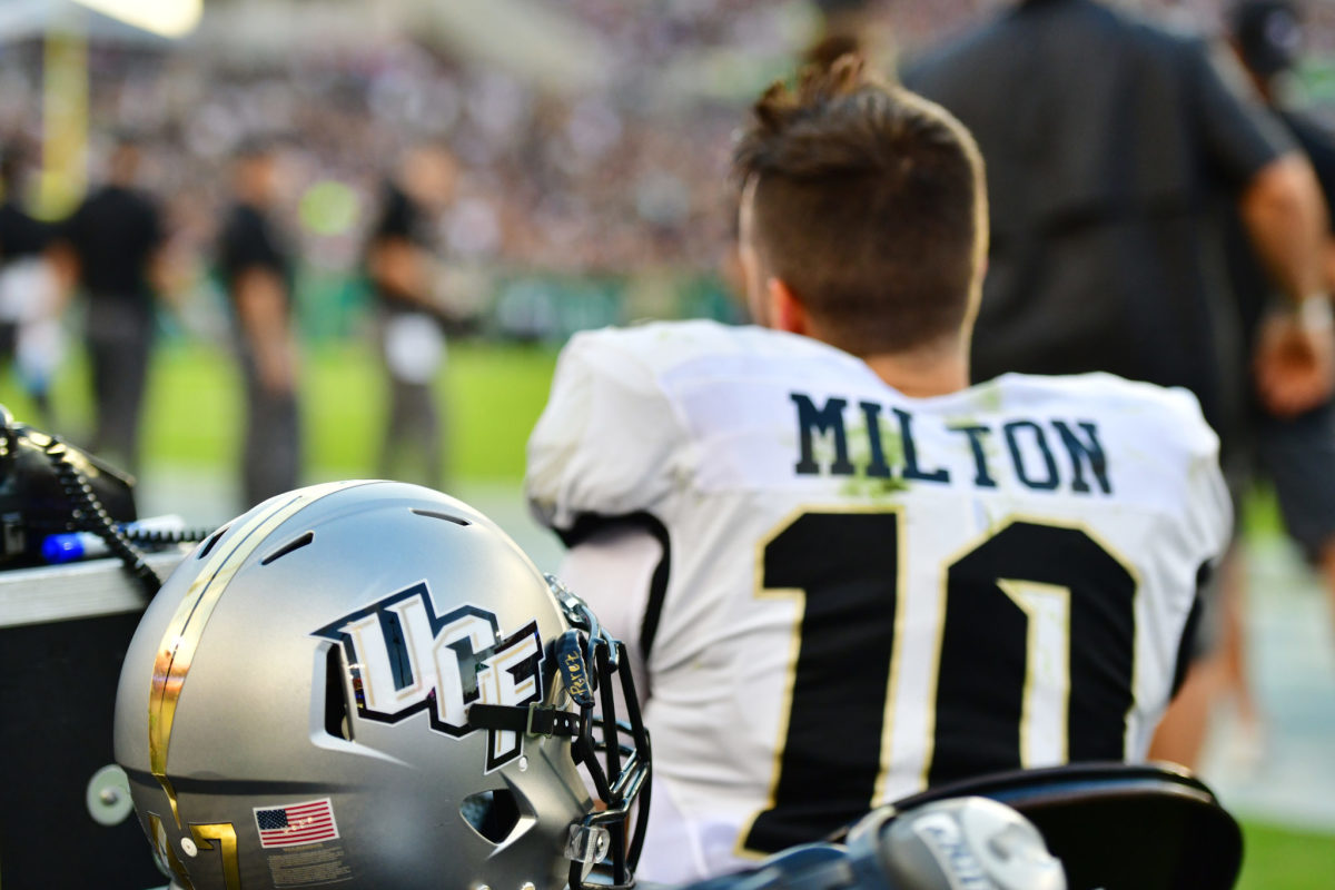 ucf star quarterback mckenzie milton looks onto the field