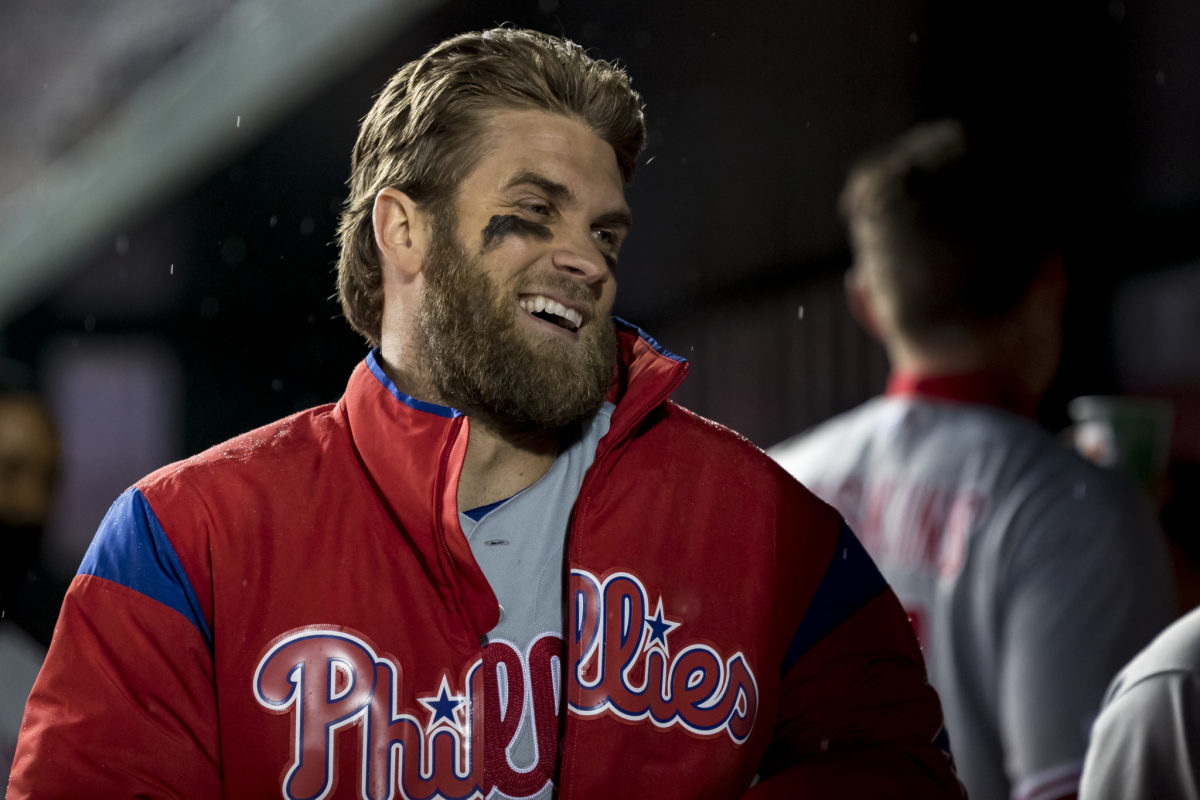 Bryce Harper laughing in the dugout.