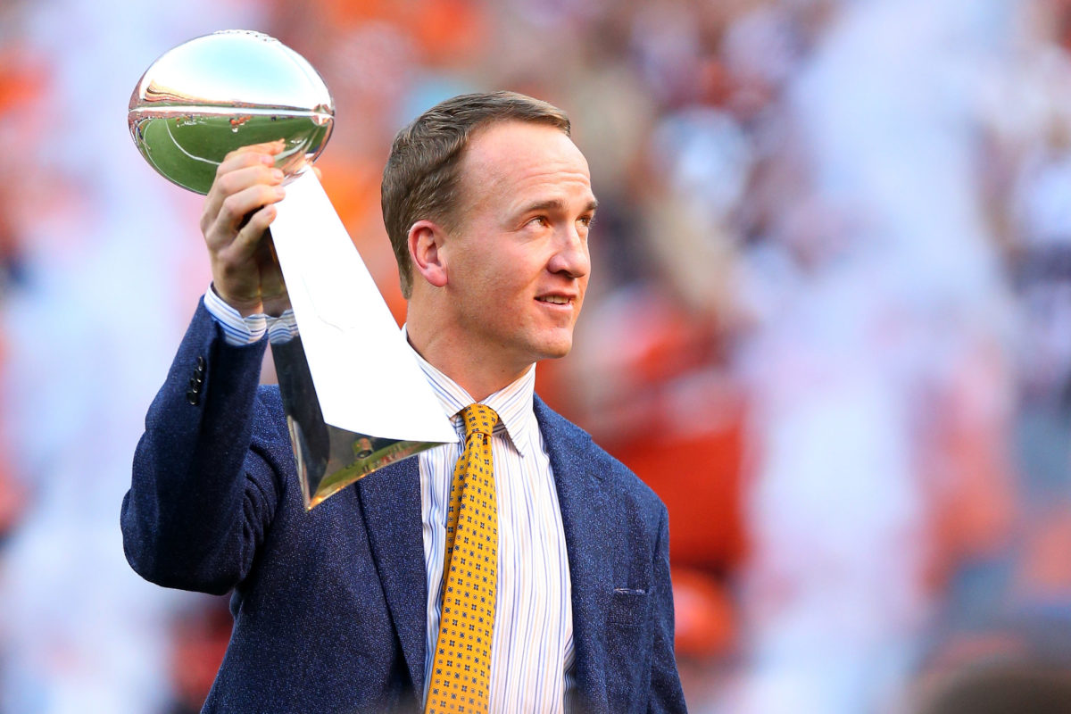 Peyton Manning raising the Super Bowl trophy.