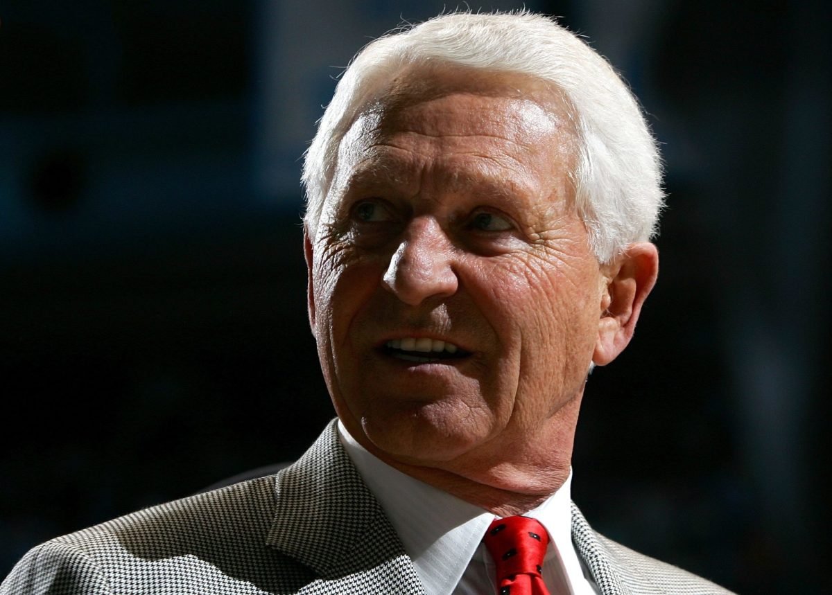 Lute Olson smiles on the sidelines during an Arizona game.