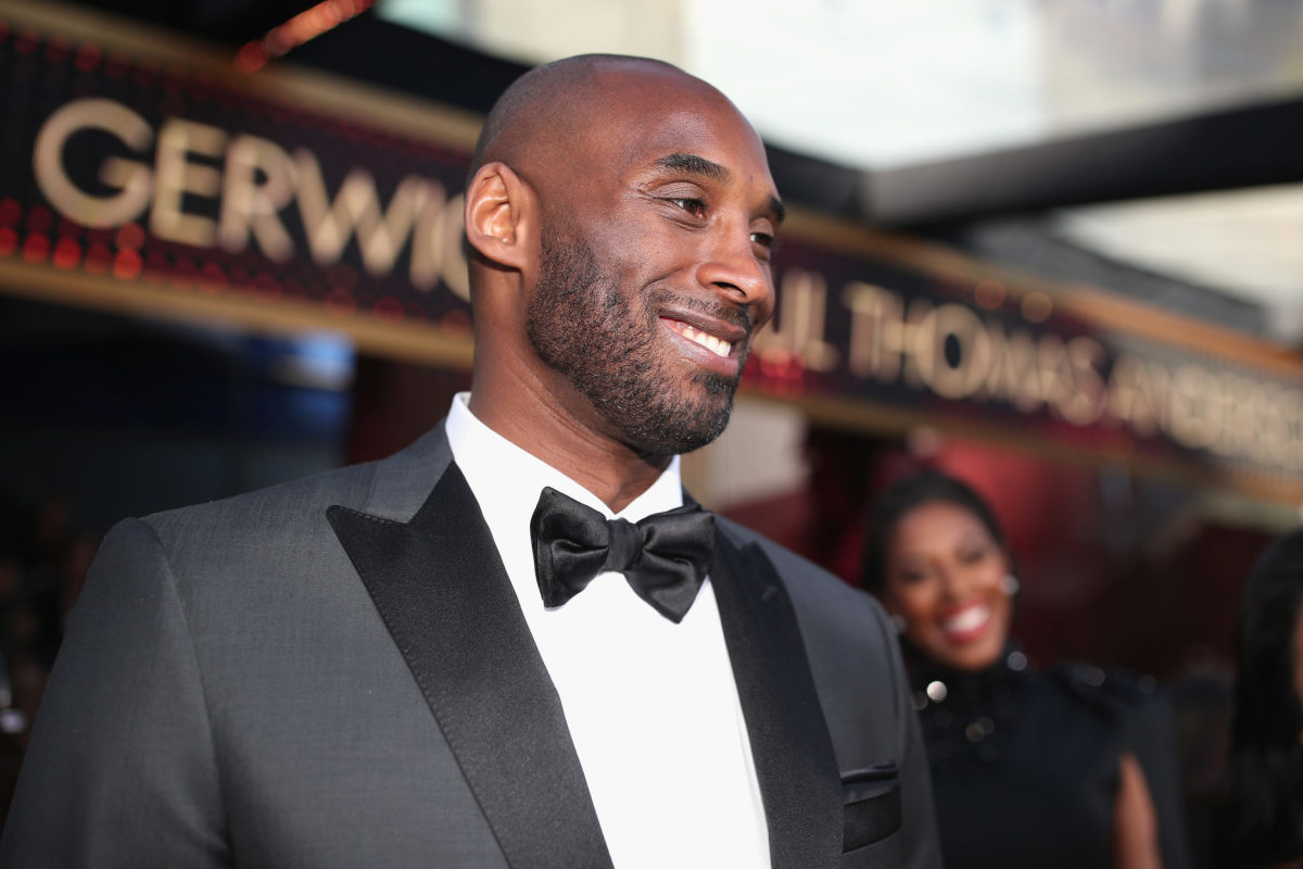 A closeup of Kobe Bryant wearing a suit.