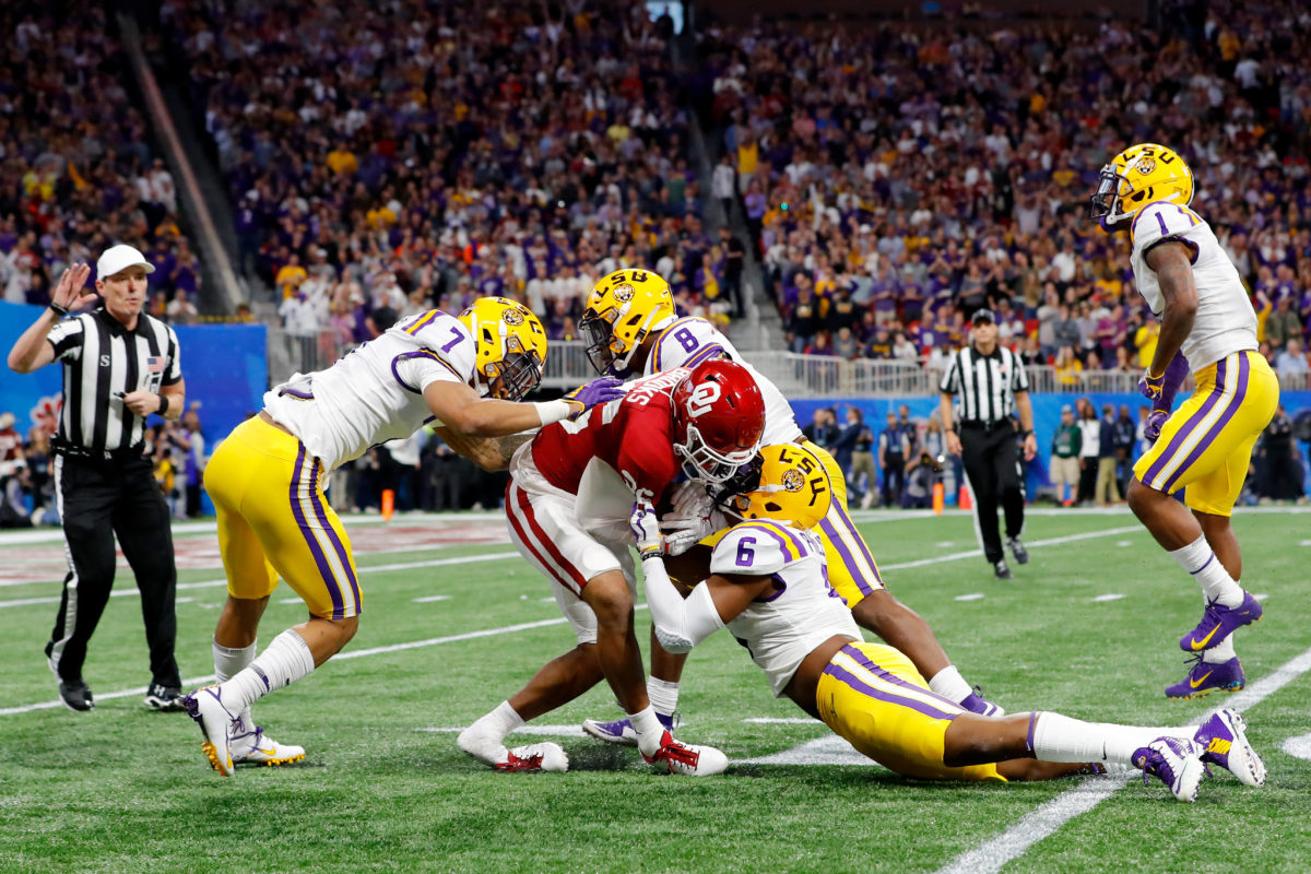 LSU defenders gang up on Kennedy Brooks during the CFP semifinal.