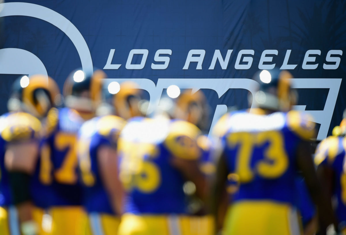 A blurry pictures of players on the Los Angeles Rams.