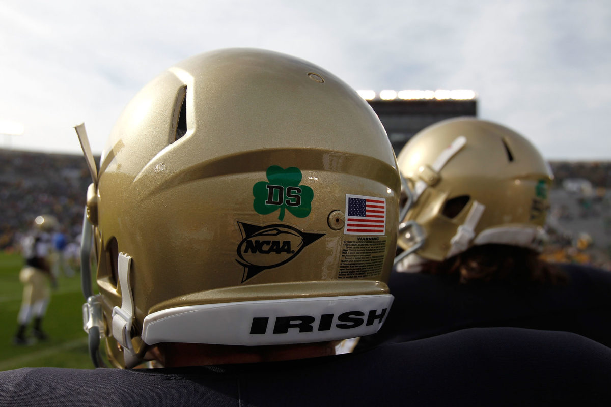A closeup of the back of a Notre Dame Fighting Irish helmet.