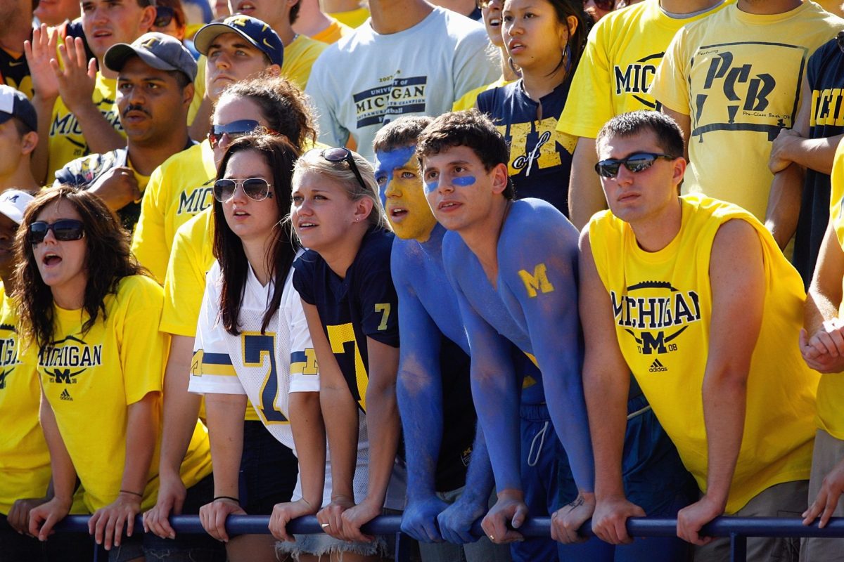 Fans of the Michigan Wolverines watch the action during the game against the Utah Utes.