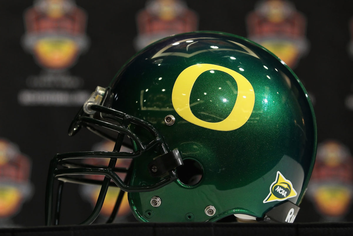A picture of a green Oregon Ducks helmet.