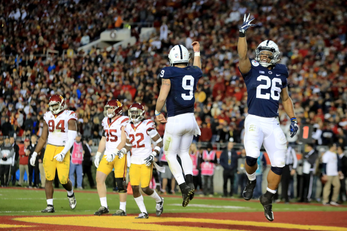 Penn State's Trace McSorley and Saquon Barkley celebrate a touchdown in the Rose Bowl.