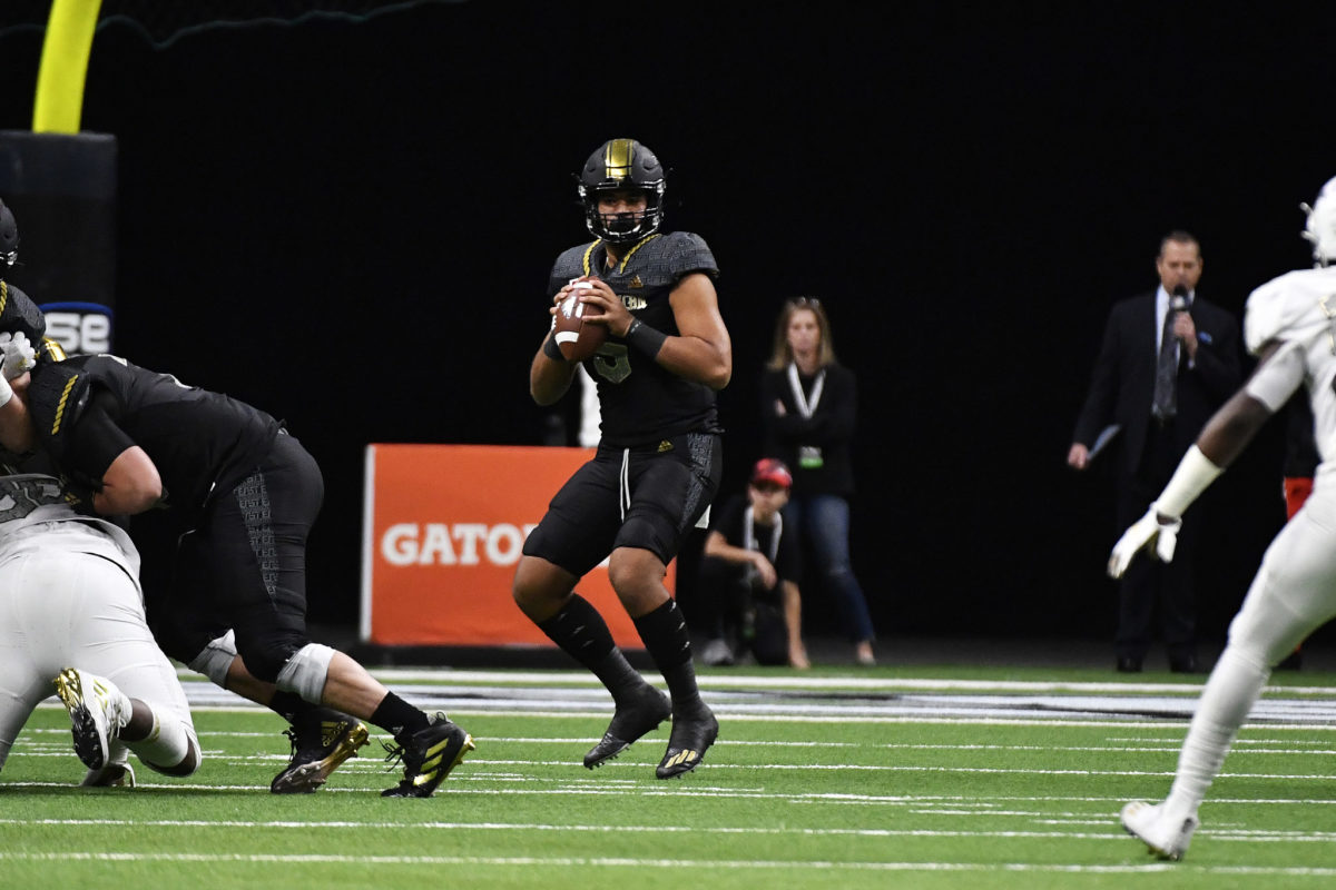 DJ Uiagalelei drops back to pass during the All-American Bowl.