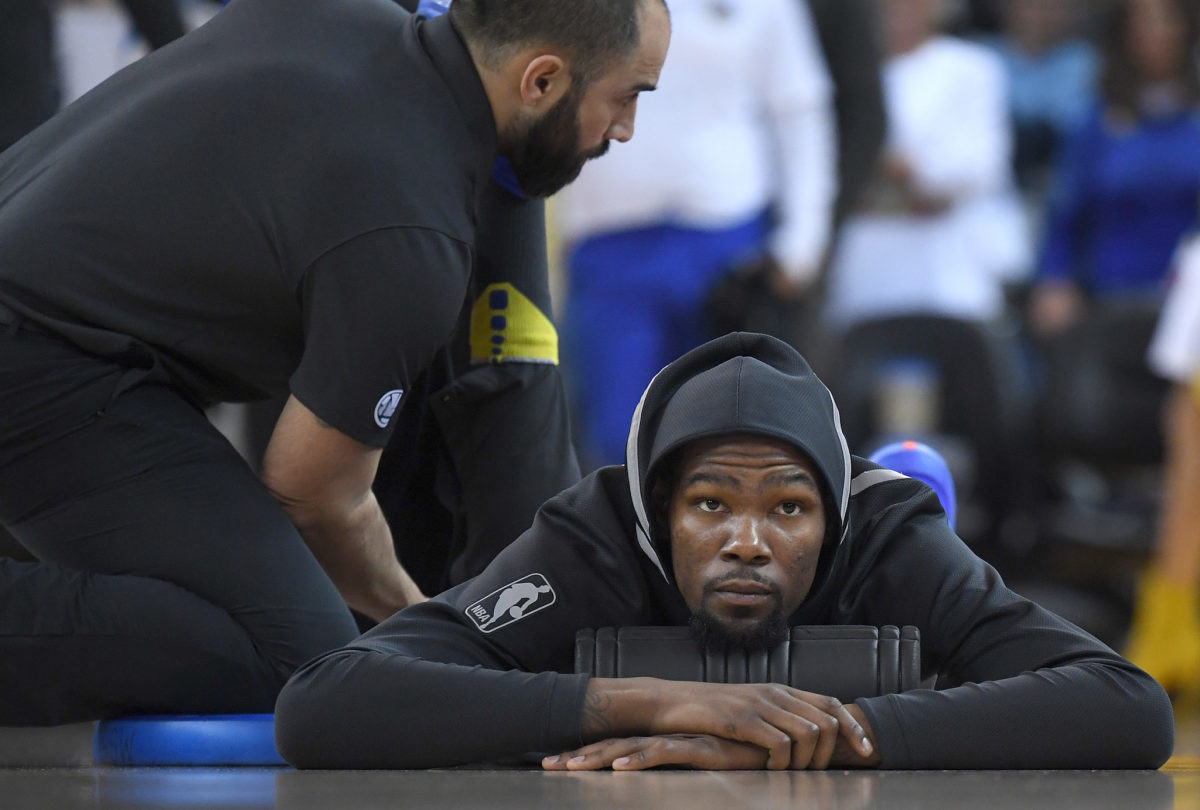 Kevin Durant stretching during warmups.