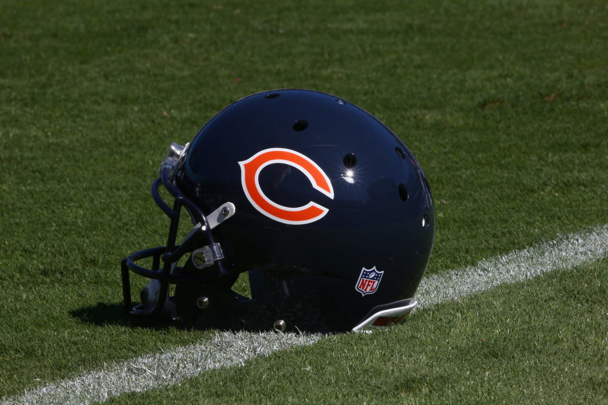 A Chicago Bears helmet sitting on the field.