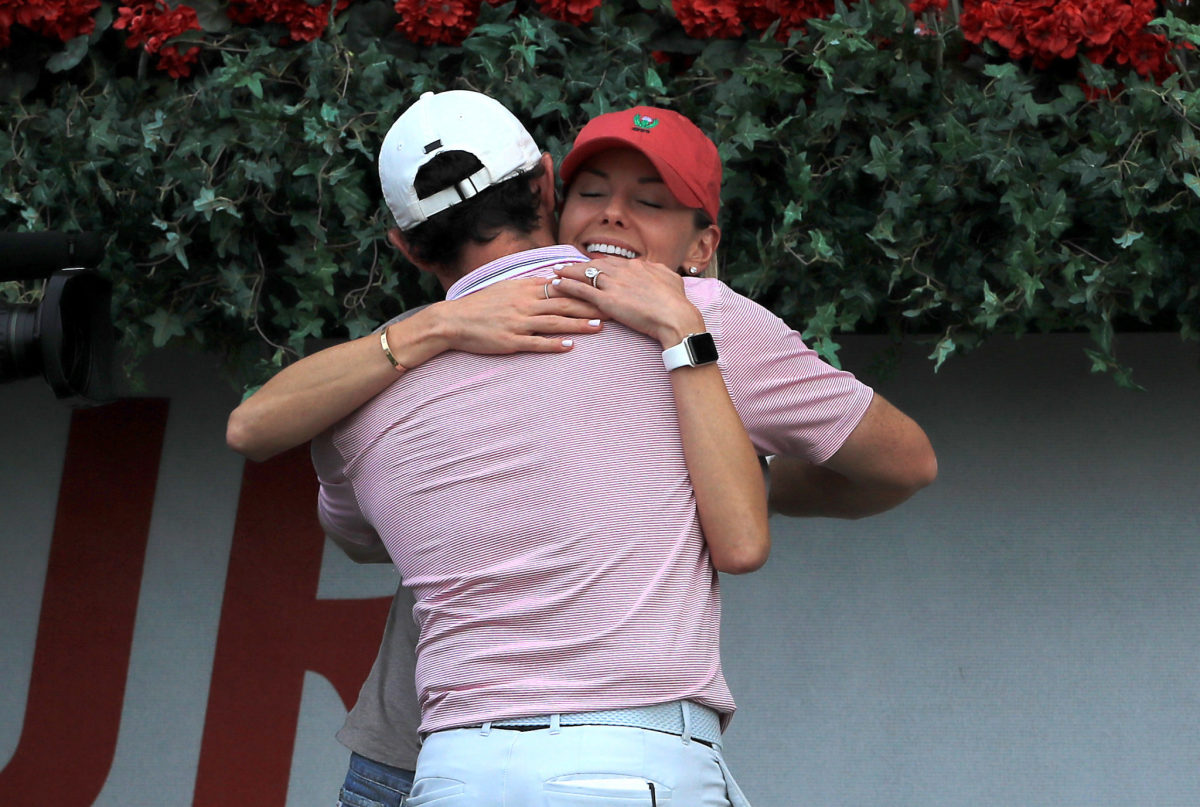 Rory McIlroy celebrates with his wife at the Tour Championship.