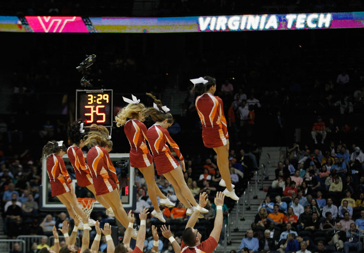 Virginia Tech cheerleaders performing during a game.