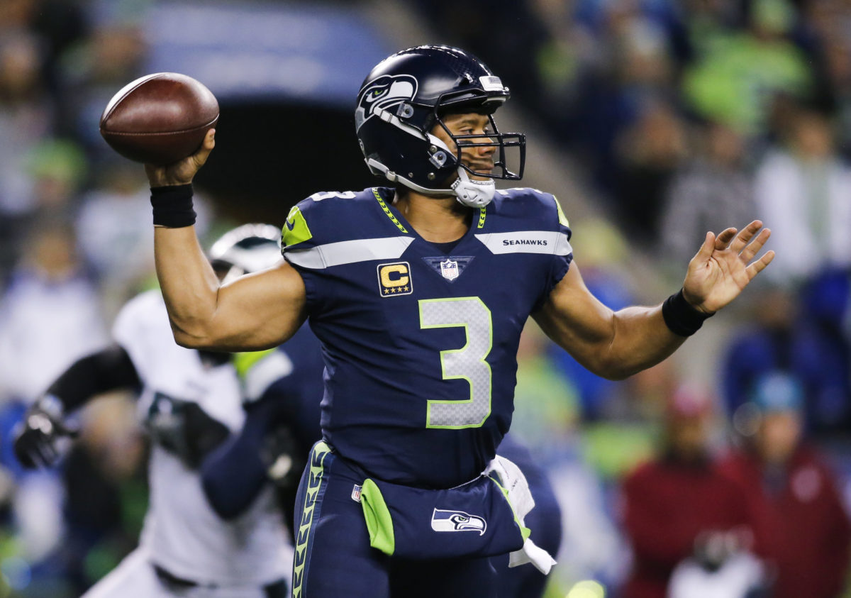 Russell Wilson throws a pass for the Seahawks.