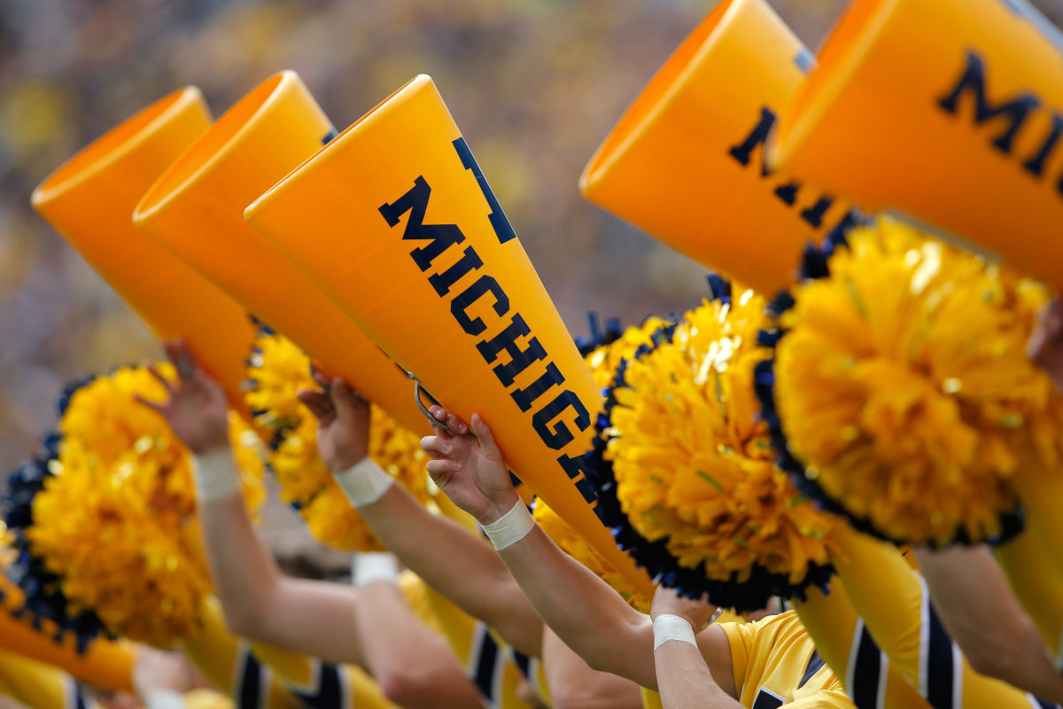 The Michigan Wolverines Cheerleaders support their team against the Brigham Young Cougars at Michigan Stadium.