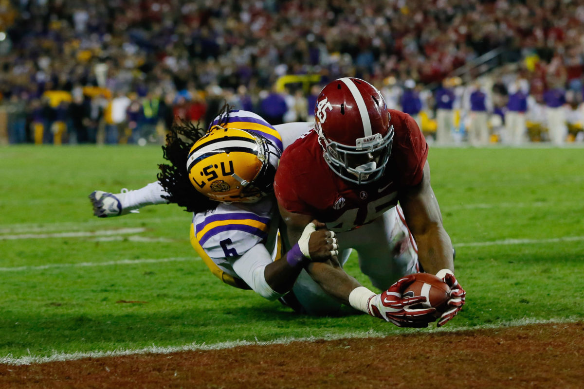 Jalston Fowler of the Alabama Crimson Tide scores a touchdown against Craig Loston #6 of the LSU Tigers during a huge SEC Football battle.