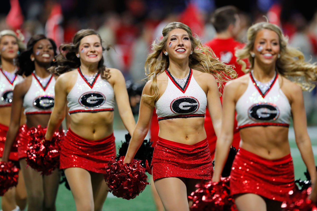 Georgia Bulldogs cheerleaders performing during a game.