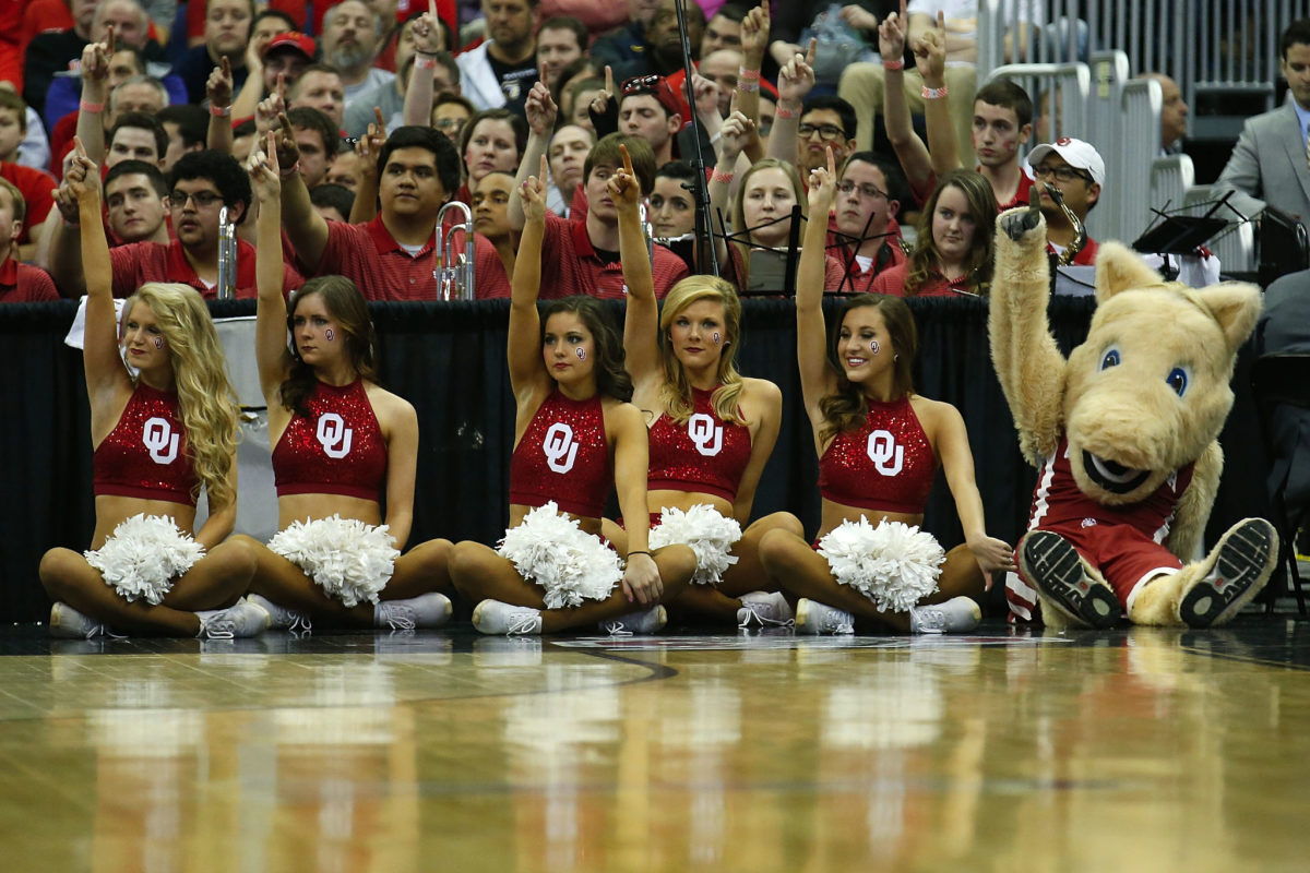 A view of Oklahoma's cheerleaders and mascot during a basketball game.