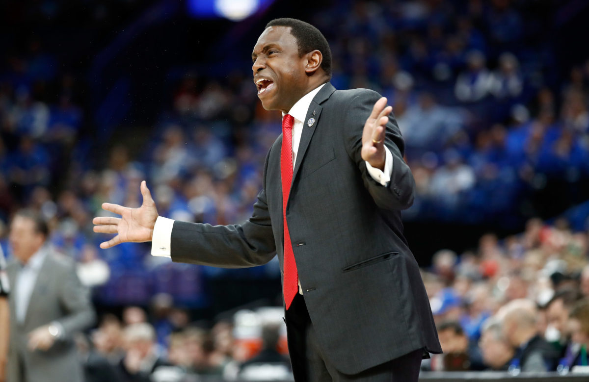 Avery Johnson the head coach of the Alabama Crimson Tide gives instructions to his team.
