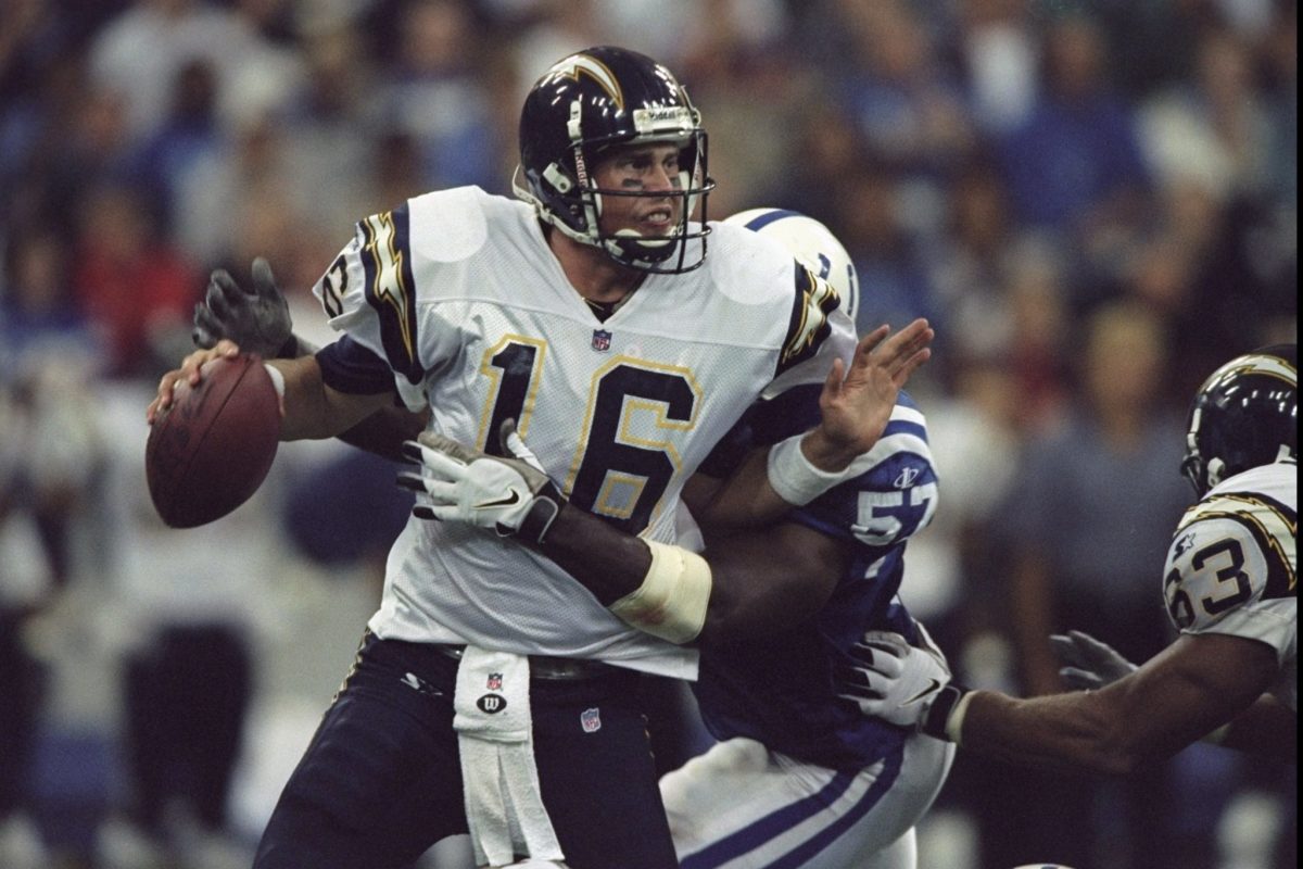 Quarterback Ryan Leaf #16 of the San Diego Chargers is sacked from behind by Bertran Berry #57 of the Indianapolis Colts.