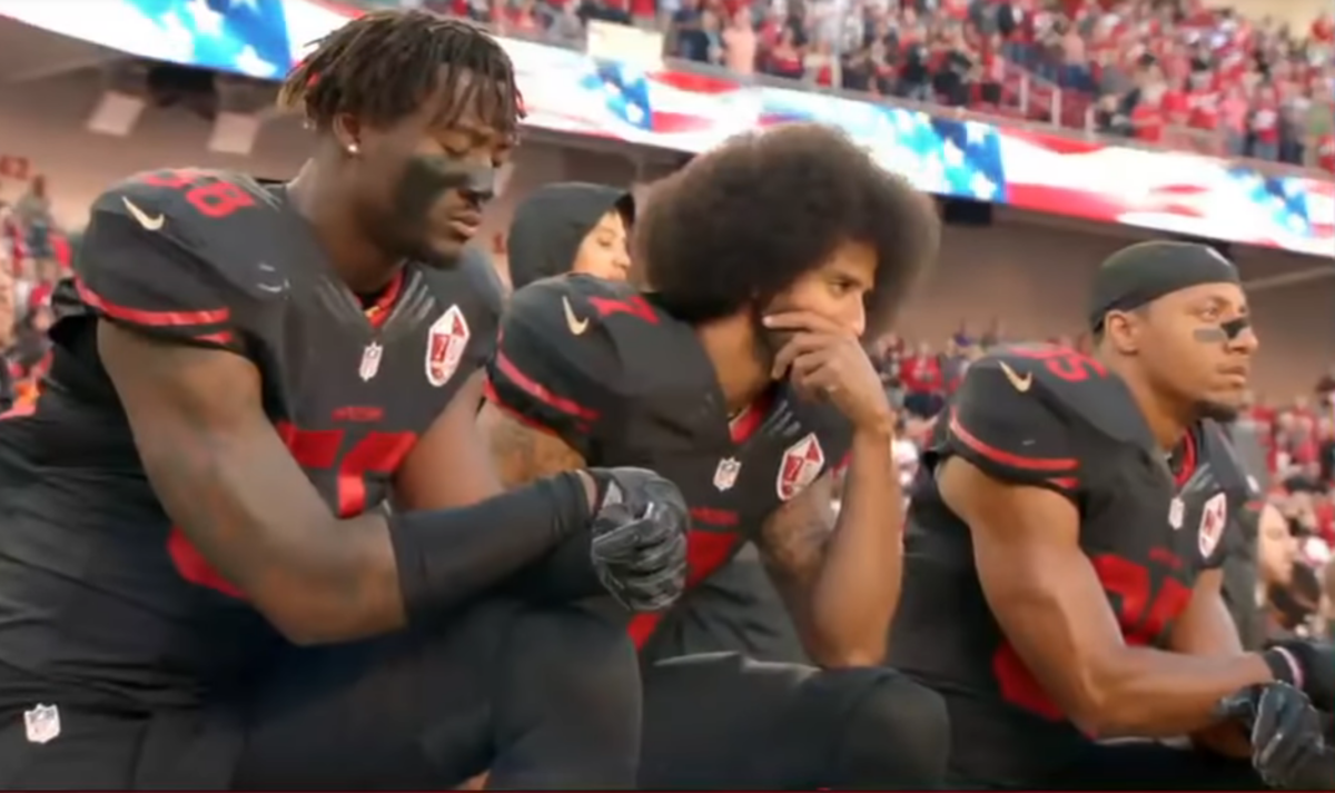Colin Kaepernick kneels during national anthem