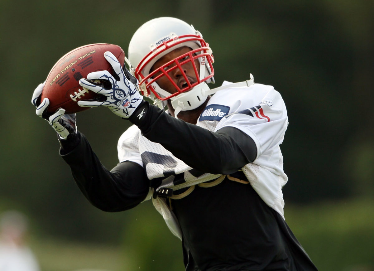 FOXBORO, MA - AUGUST 02:  Torry Holt #84 of the New England Patriots catches a pass during training camp on August 2, 2010 at Gillette Stadium in Foxboro, Massachusetts.  (Photo by Elsa/Getty Images)
