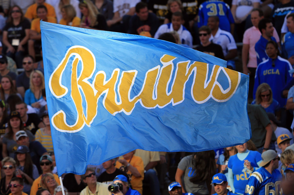 The Bruins flag flies as the UCLA Bruins score a touchdown against the Colorado Buffaloes at Folsom Field.