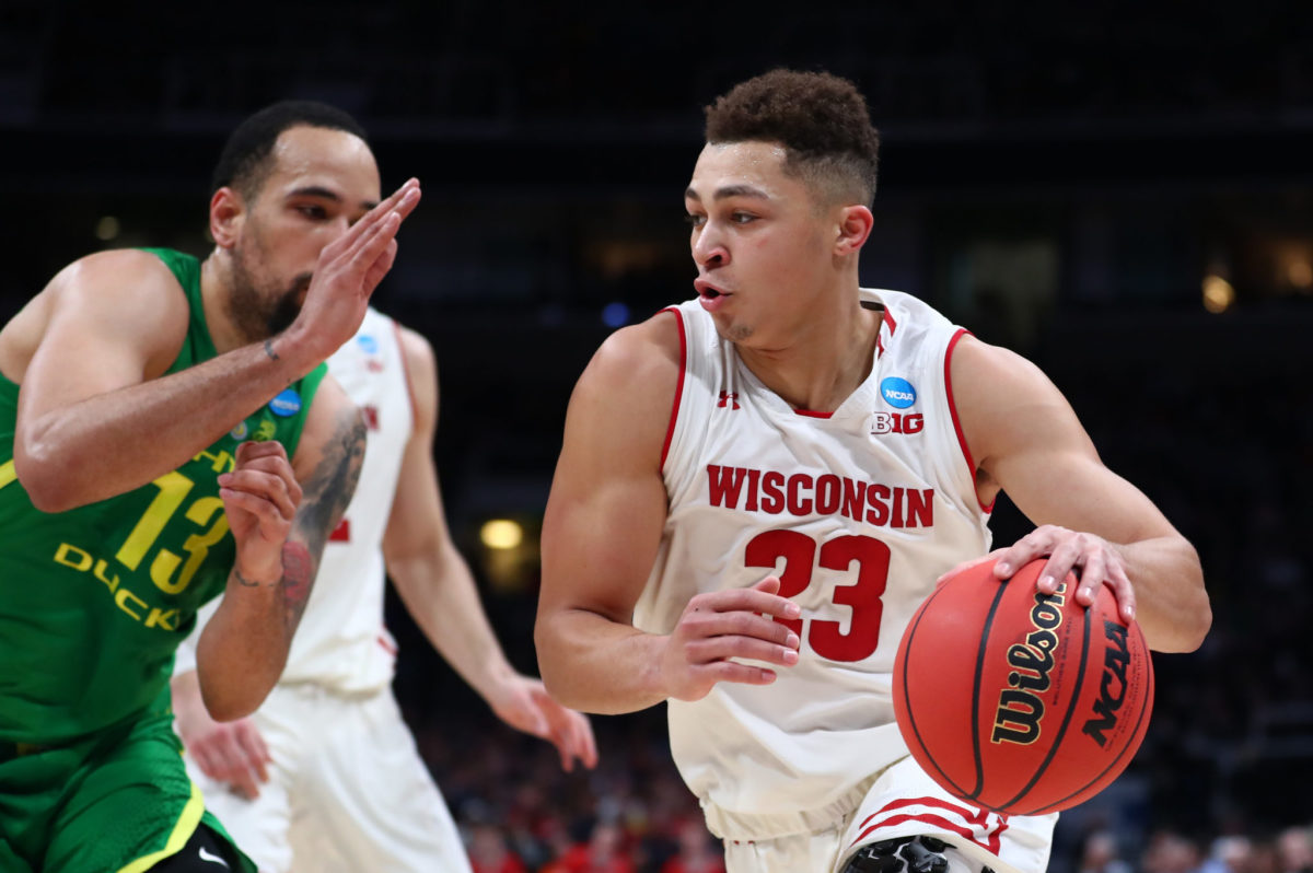 Wisconsin's Kobe King dribbles the ball in an NCAA Tournament game against Oregon.