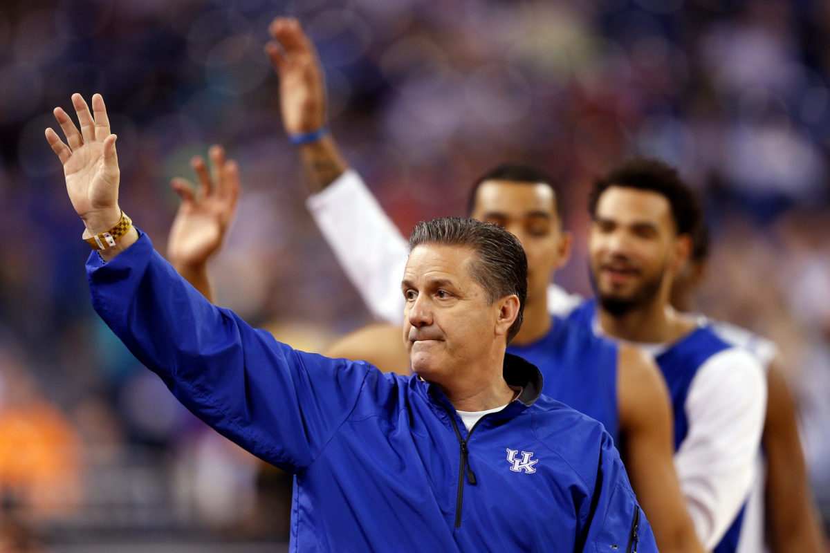 Head coach John Calipari of the Kentucky Wildcats acknowledges the fans during practice for the NCAA Men's Final Four.