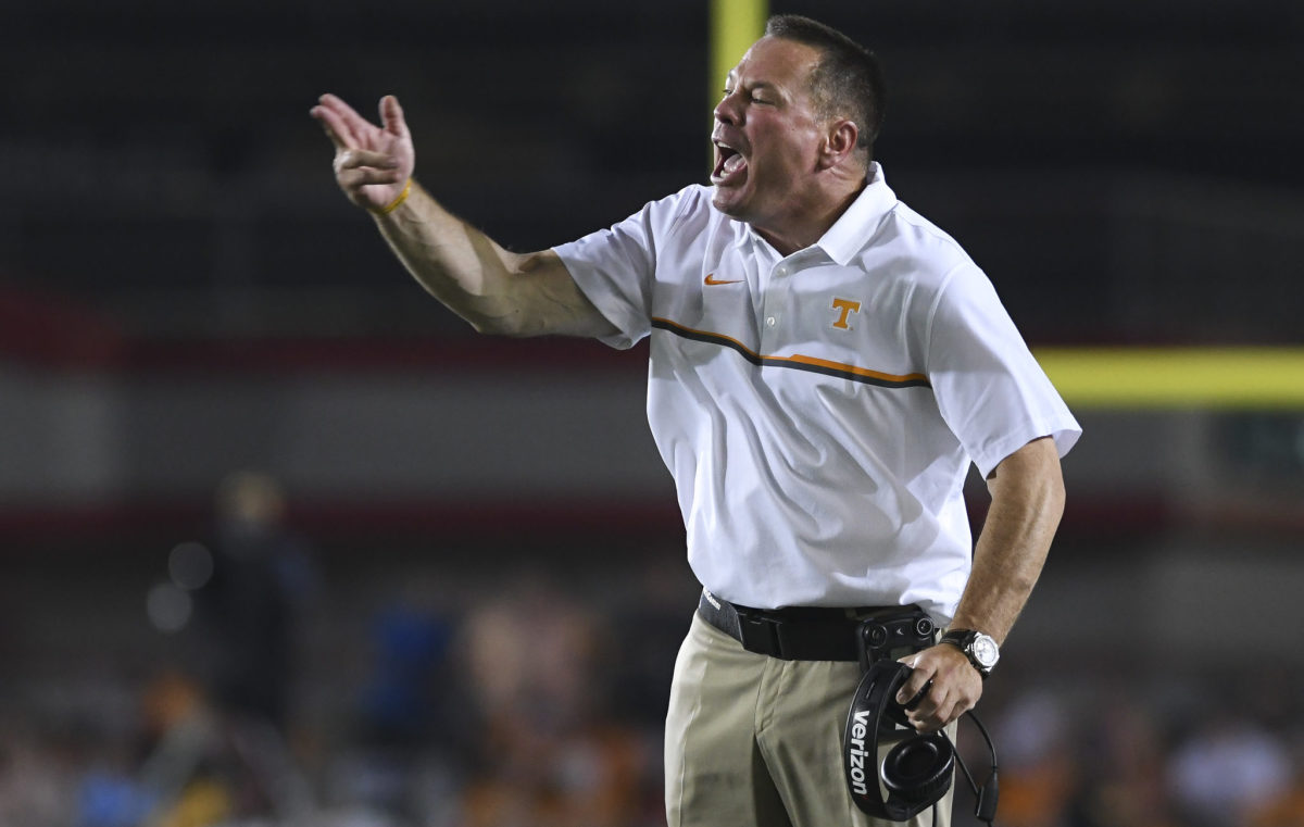 Butch Jones argues with officials during a game.