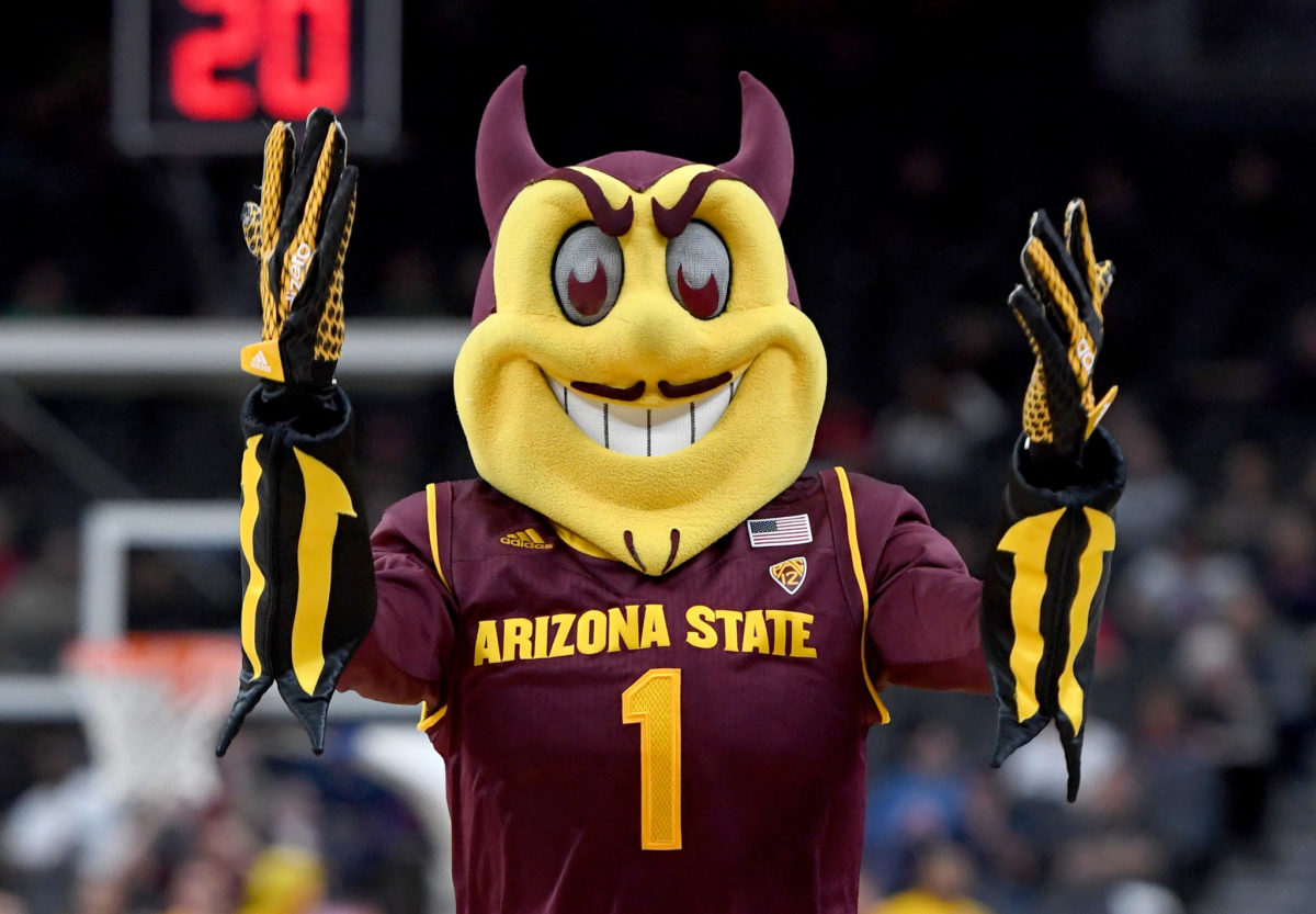 Arizona State Sun Devils mascot Sparky the Sun Devil stands on the court during the team's first-round game of the Pac-12 basketball tournament against the Colorado Buffaloes.