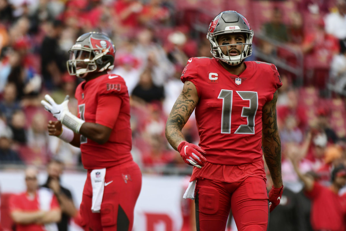 Mike Evans walking on the field during a Buccaneers game. He and Chris Godwin are among the NFL's best WR pairs.