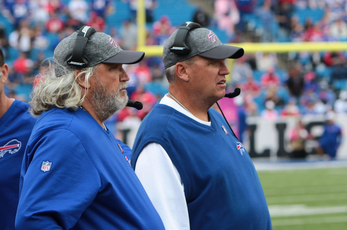 rob and rex ryan on the sideline during a game