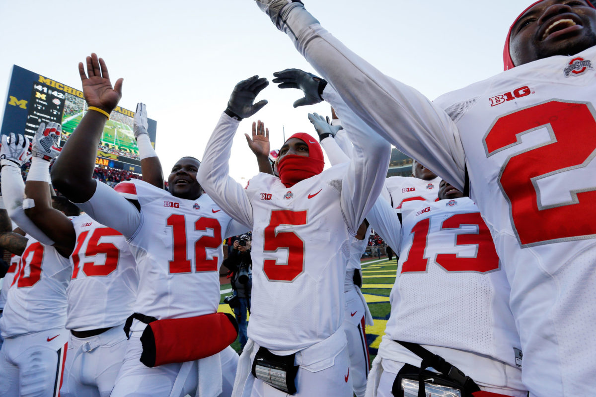 Ohio State football players celebrating after a victory.