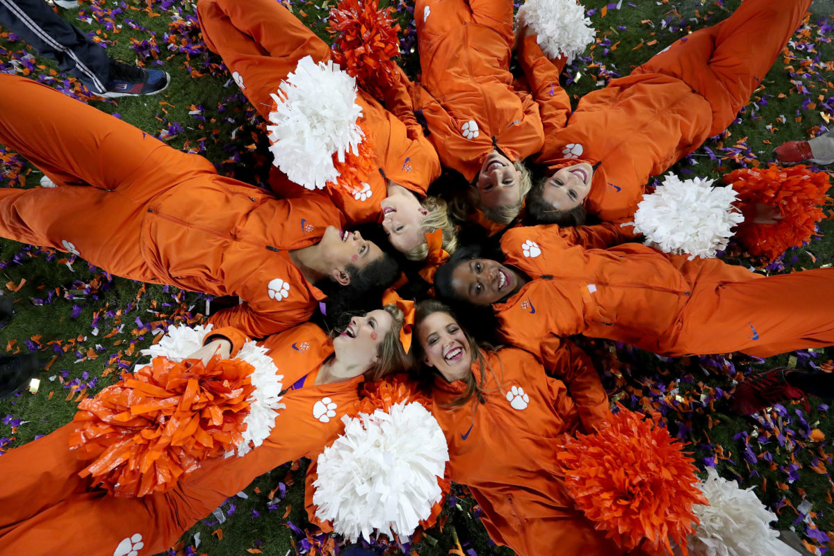 Clemson Tigers cheerleaders celebrate in confetti after the Clemson Tigers defeated the Alabama Crimson Tide 35-31 in the 2017 College Football Playoff National Championship Game.