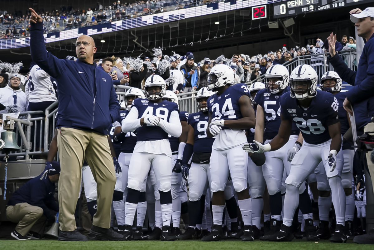 James Franklin leads Penn State out of the tunnel.