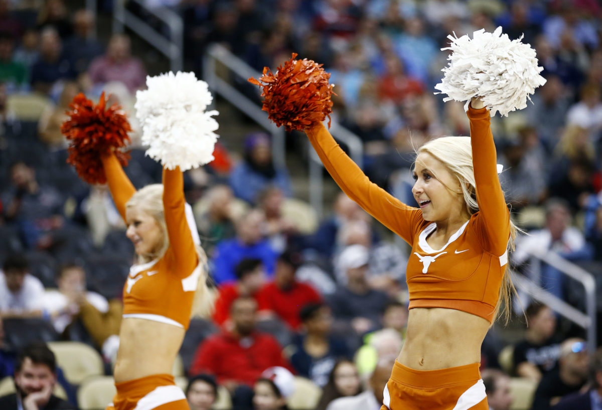 A closeup of two Texas Longhorns cheerleaders.