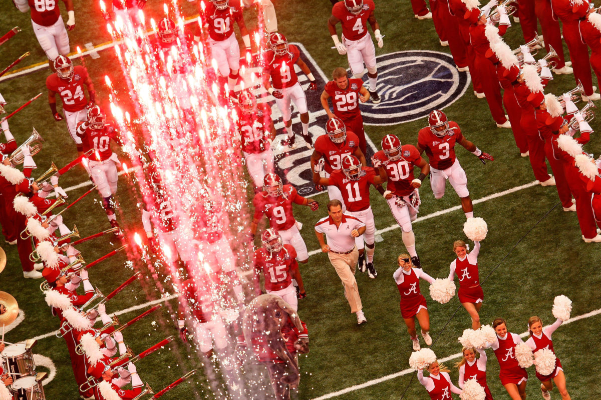 Head coach Nick Saban of the Alabama Crimson Tide takes the field with his players during the 2012 Allstate BCS National Championship Game.