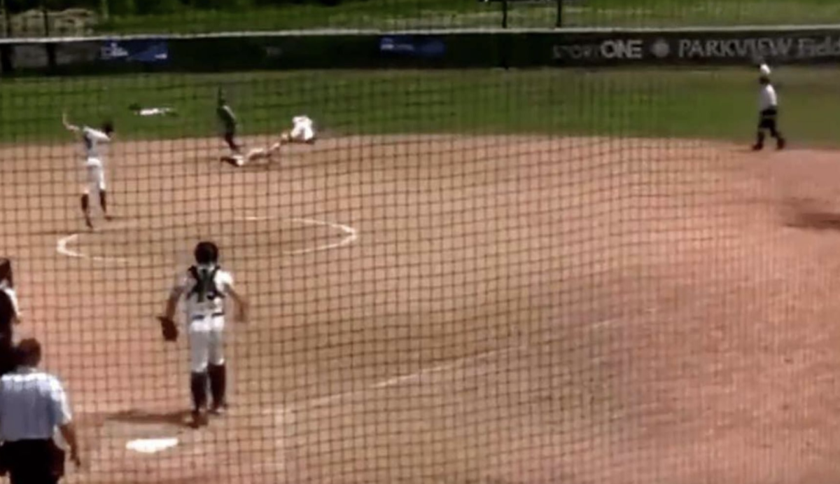 A college softball team uses the hidden ball trick to perfection.
