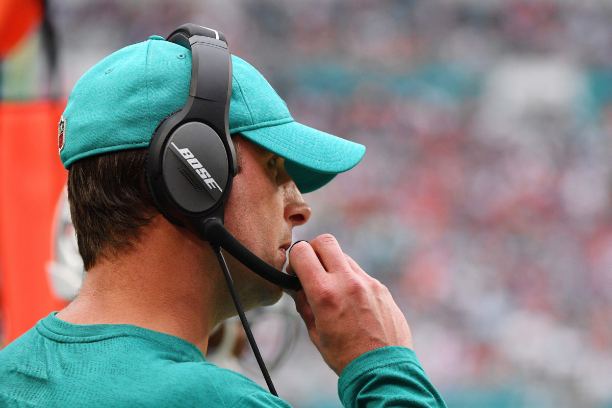 Adam Gase of the Miami Dolphins looks on.