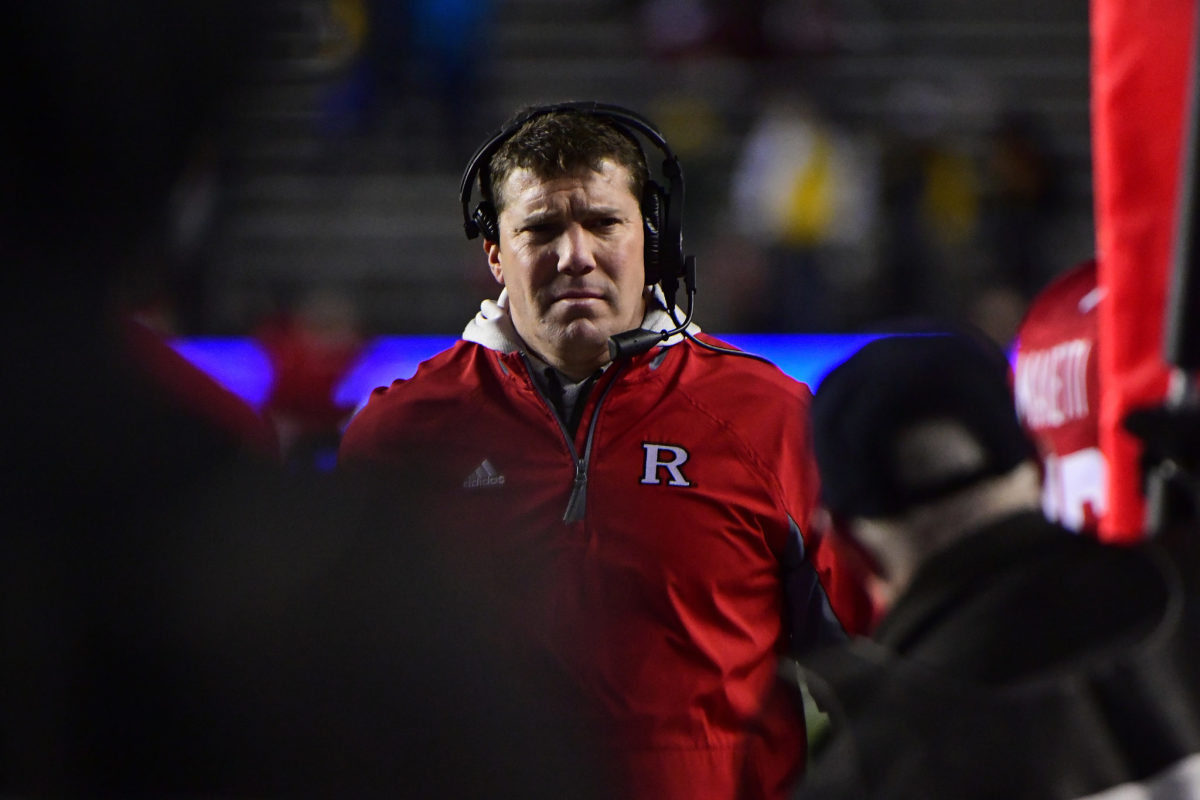 A closeup of Rutgers coach Chris Ash during a football game.