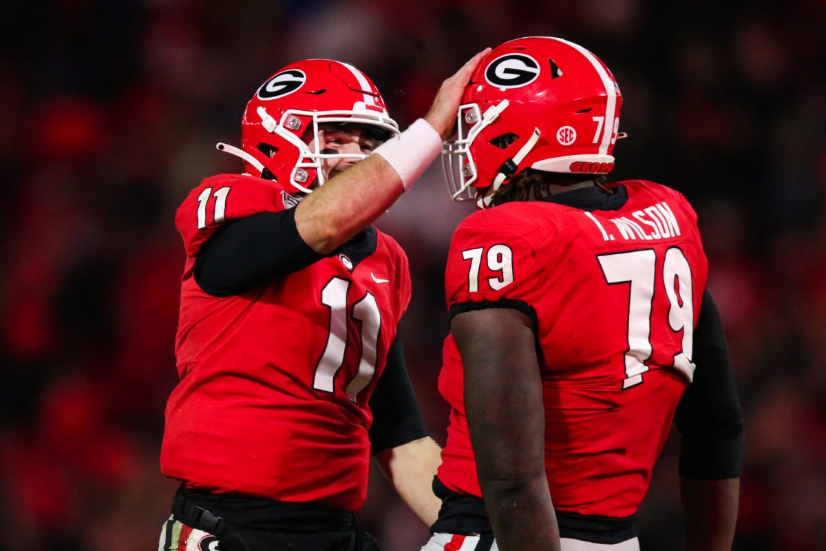 Isaiah Wilson celebrates with Jake Fromm of the Georgia Bulldogs.