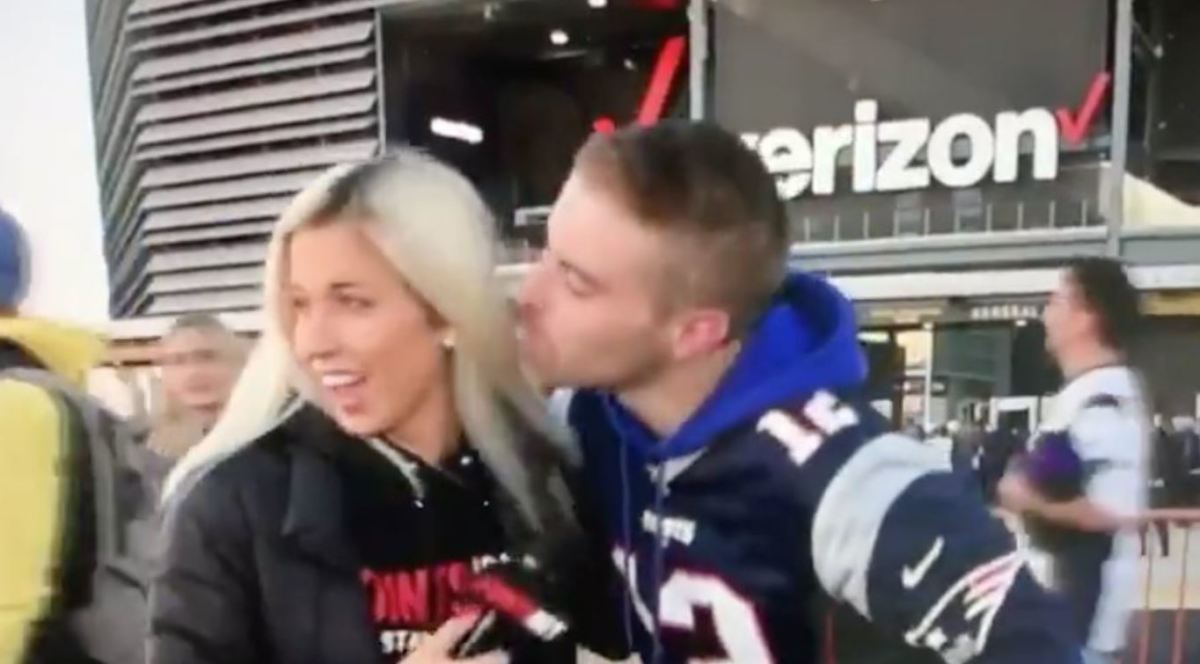 Patriots fan tries to kiss PointsBet reporter Erin Kate Dolan during interview.