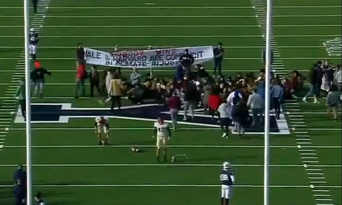 Students protest climate change during the Harvard-Yale game in New Haven.