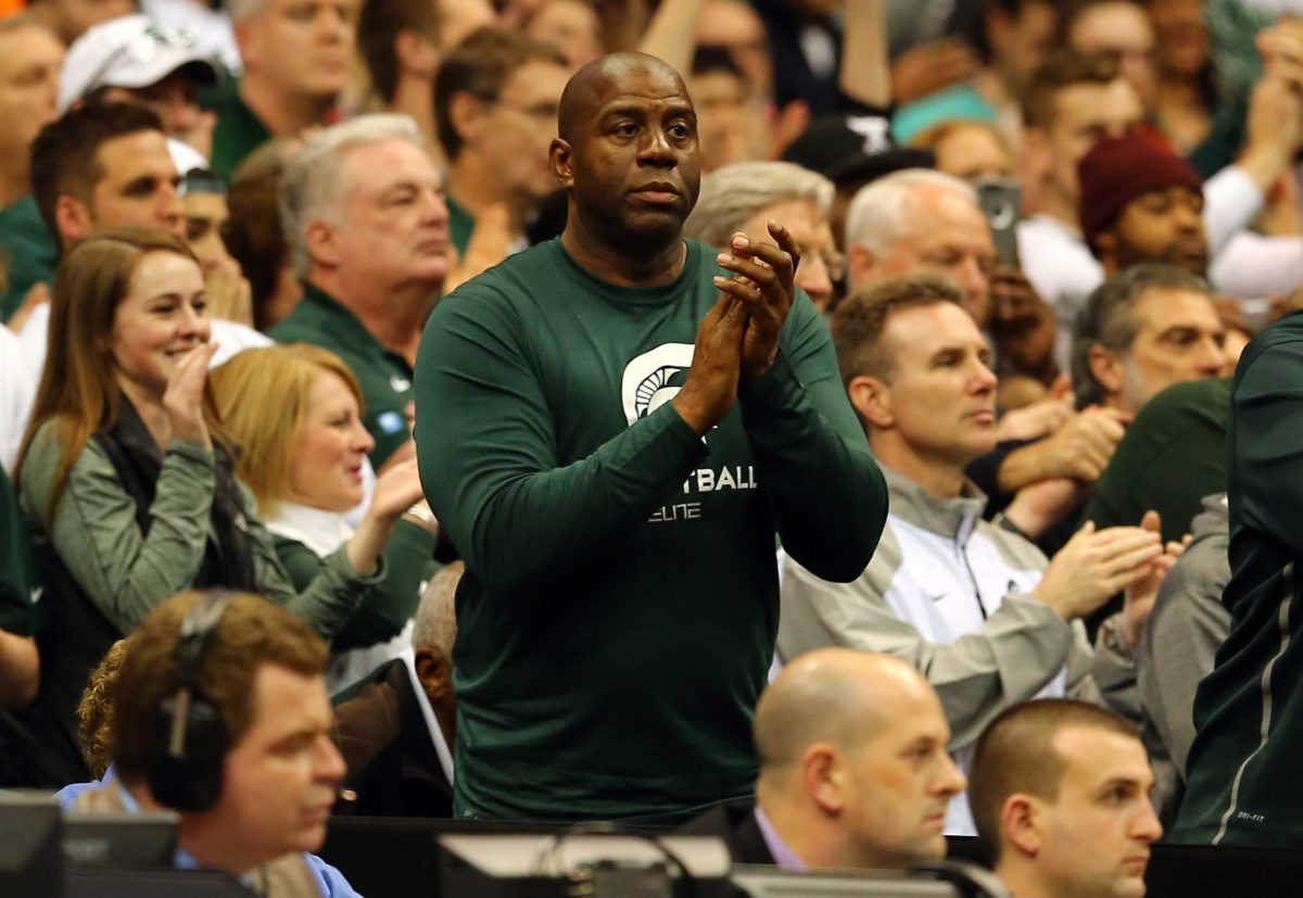 Magic Johnson cheers on the Spartans.