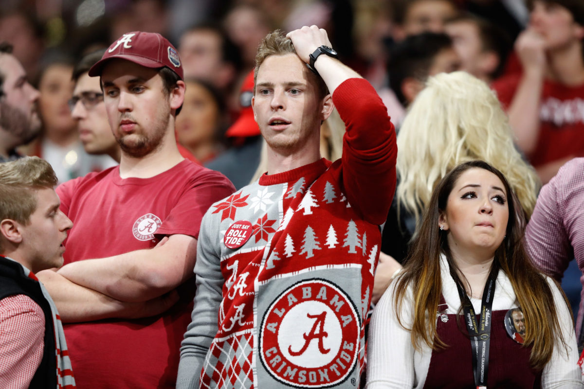Alabama Crimson Tide fans react to a missed field goal during the fourth quarter against the Georgia Bulldogs.