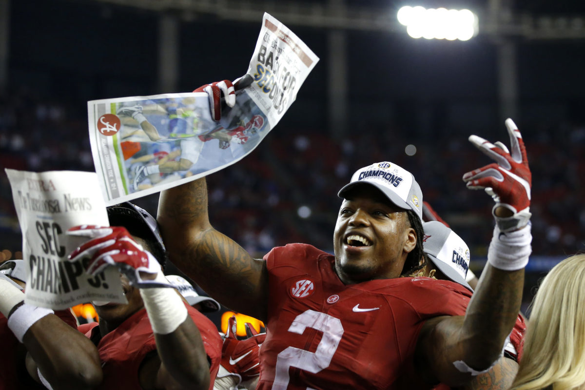 Running back Derrick Henry of the Alabama Crimson Tide celebrates with his team after defeating the Florida Gators 29-15 in the SEC Championship.