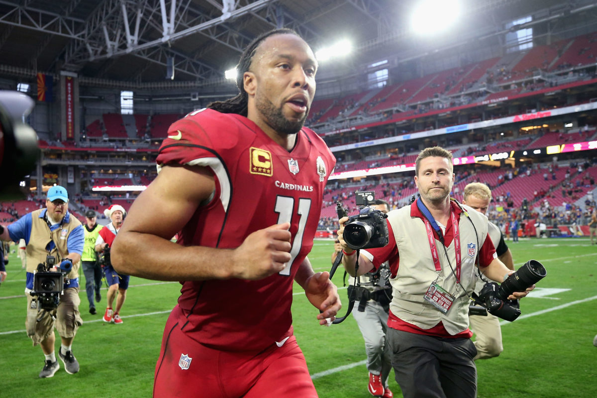Arizona Cardinals WR Larry Fitzgerald jogs off the field after a game.