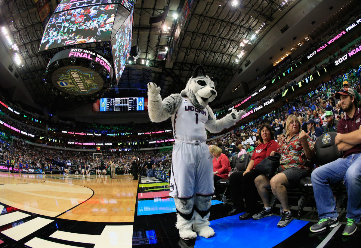 UConn's mascot interacting with the fans.